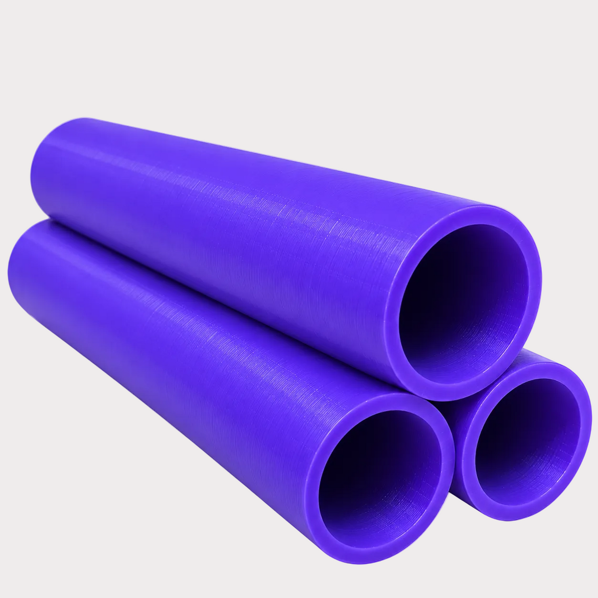 Three purple plastic  tubes arranged in a stacked pyramid on a plain white background.
